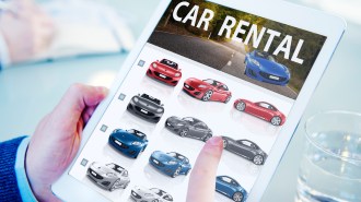 Hands Holding Digital Tablet Car Rental