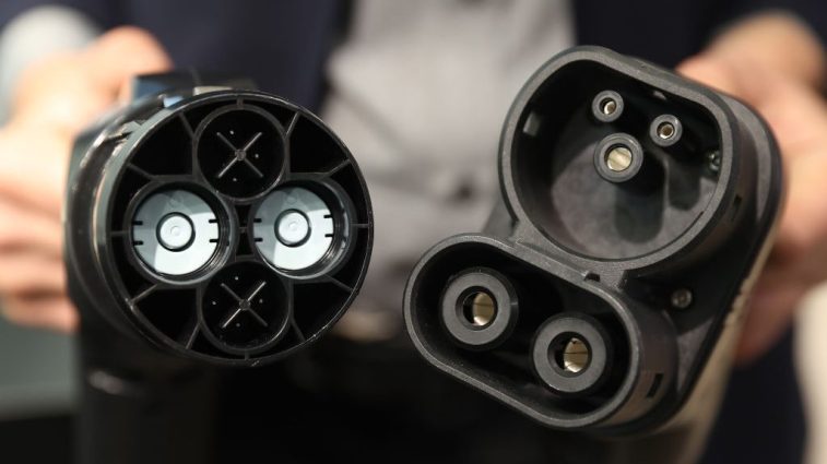 Two electric car charging plugs, the left one a CHAdeMO, the standard in Japan, the right one a Type 2, standard in Europe.