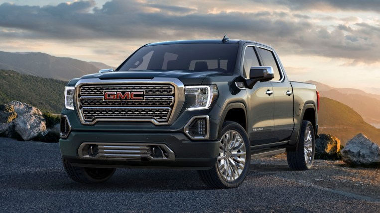 2021 GMC Sierra Denali with green hills