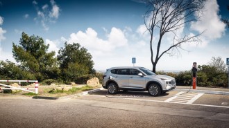 The 2022 Hyundai Santa Fe PHEV seen in profile