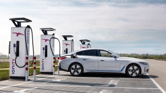 The 2023 BMW i4 plugged in to charge