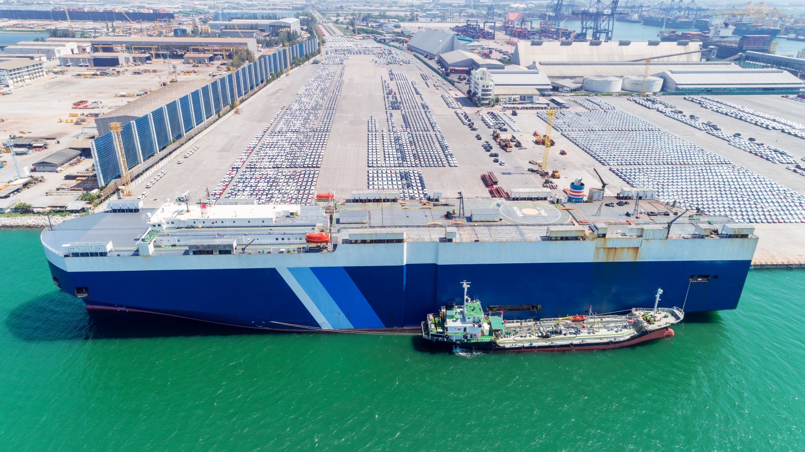 A cargo ship unloading cars in a port