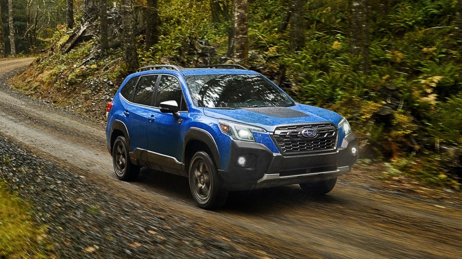 2022 Subaru Forester Wilderness driving in forest.