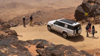 2023 Land Rover Defender 130 Overhead Rear Three Quarter