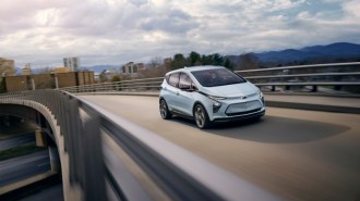 A Chevy Bolt EV driving on a highway