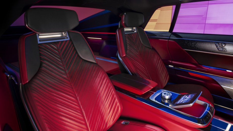 The interior of the Cadillac Celestic show car. We see the rear seats, upholstered in a leather chevron pattern that is red at the bottom and black at the top.