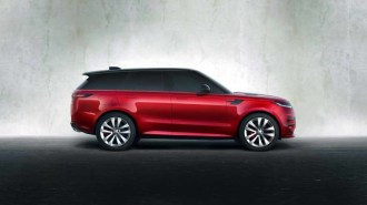The 2023 Range Rover Sport in red, seen in profile