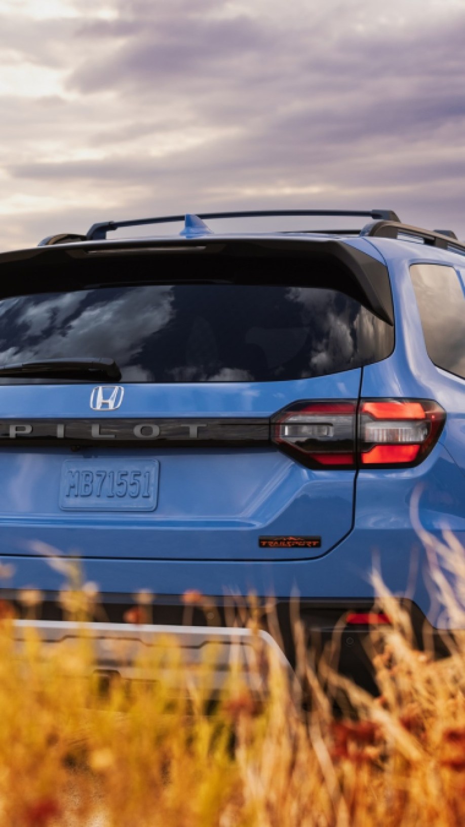 The 2023 Honda Pilot Trailsport seen from the rear with its darkened badging