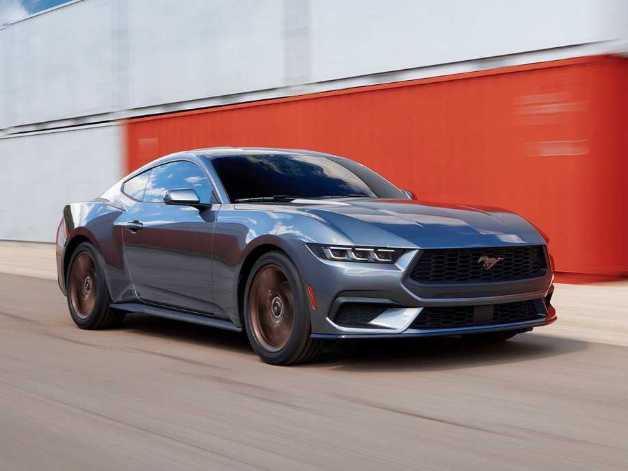 2024 Ford Mustang driving on a racetrack.