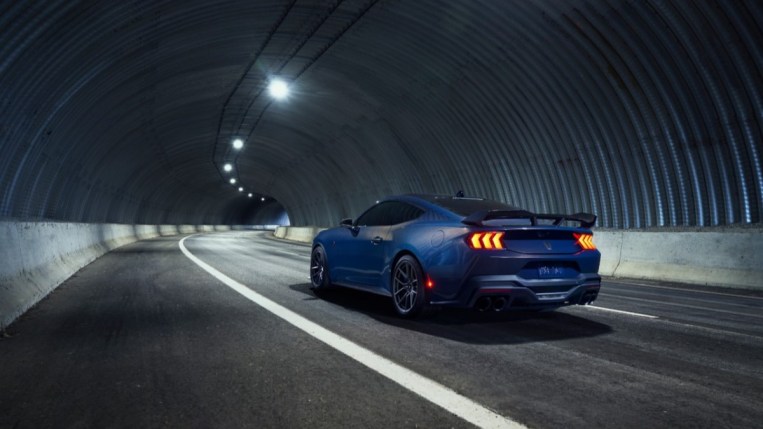 The 2024 Ford Mustang Dark Horse from a rear quarter angle