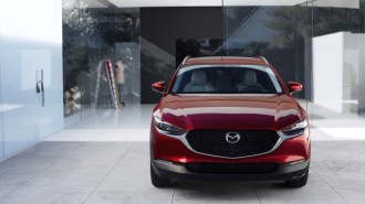 The 2023 Mazda CX-30 in red, seen from head-on