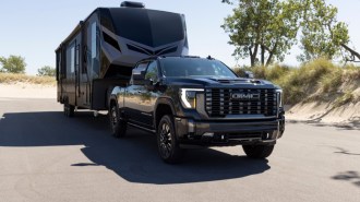 The 2024 GMC Sierra HD Denali Ultimate towing a trailer