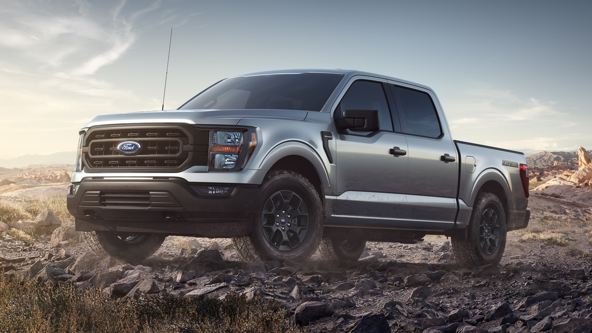 Silver 2023 Ford F-150 Rattler driving on rocky terrain
