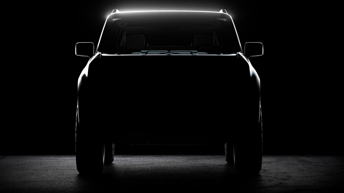 A teaser shot shows a head-on view of the first Scout EV prototype