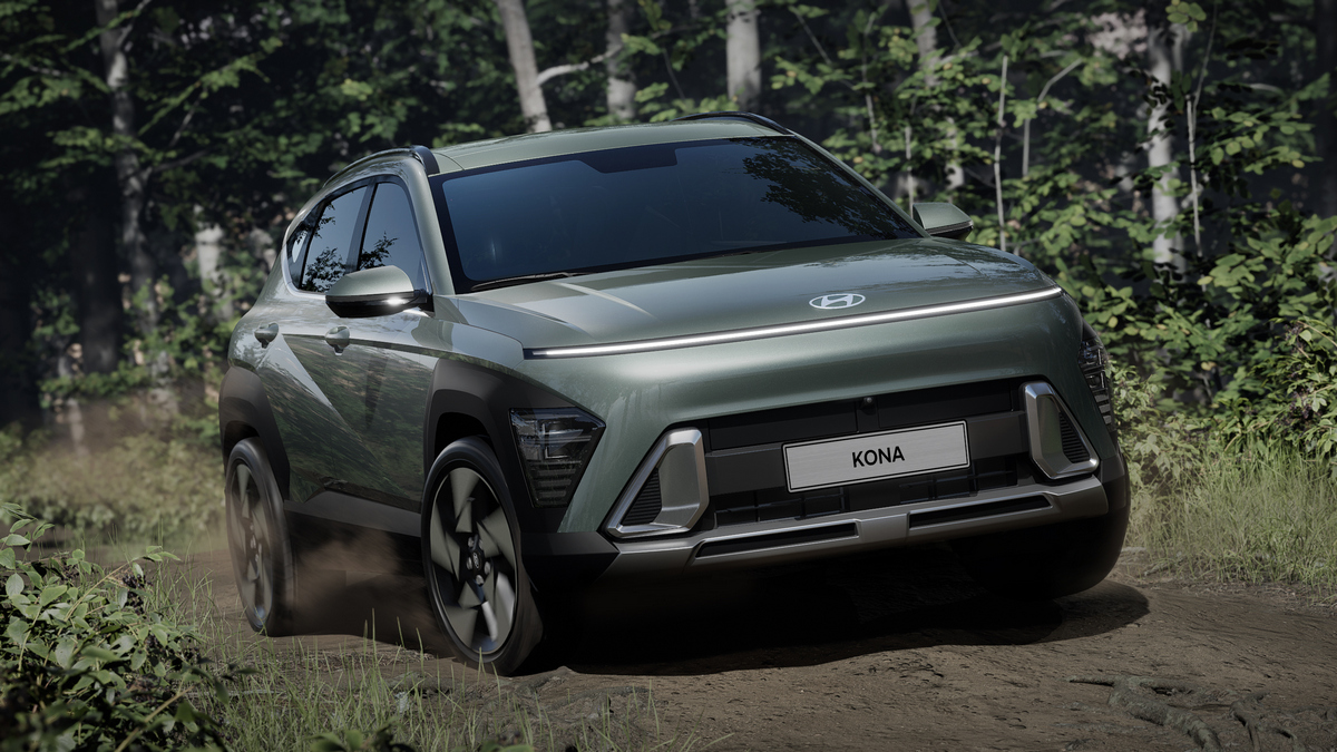 2024 Hyundai Kona Electric driving on a dirt road.