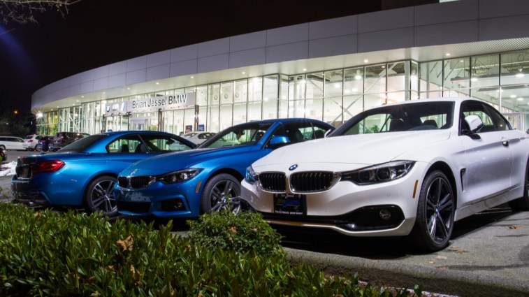 A BMW dealership lit up at night