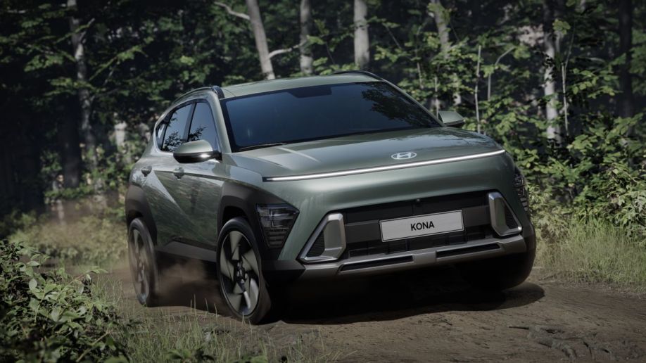 2024 Hyundai Kona driving down a dirt road seen from the front.