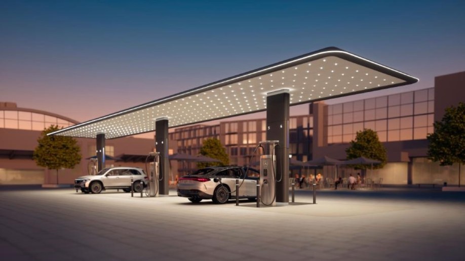 Two Mercedes electric vehicles charge at a charging station