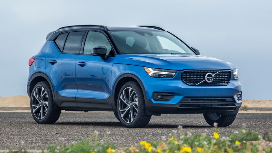 Blue 2019 Volvo XC40 parked near beach.