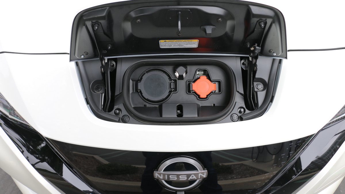 White 2023 Nissan Leaf charge port.