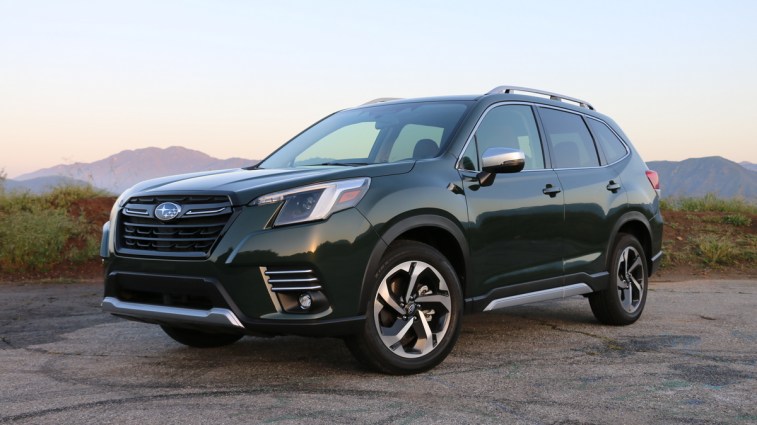 Green 2023 Subaru Forester Touring at GMR at sunrise.