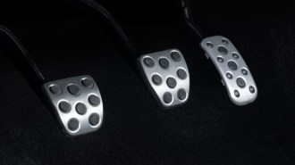 A teaser photo showing three pedals in the 2024 Toyota Tacoma midsize truck