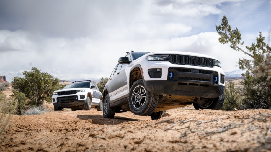 A pair of Jeep Grand Cherokee 4xe SUVs testing autonomous off-road driving technology