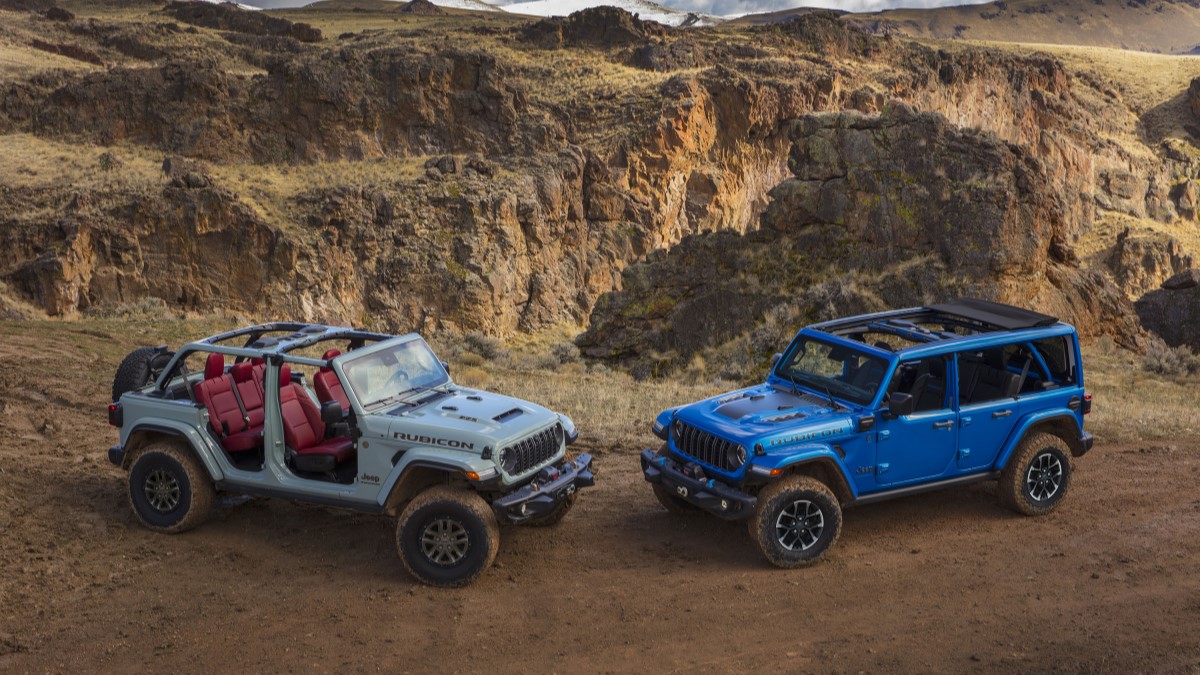 A pair of redesigned 2024 Jeep Wranglers showing roof options