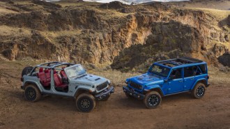 A pair of redesigned 2024 Jeep Wranglers showing roof options