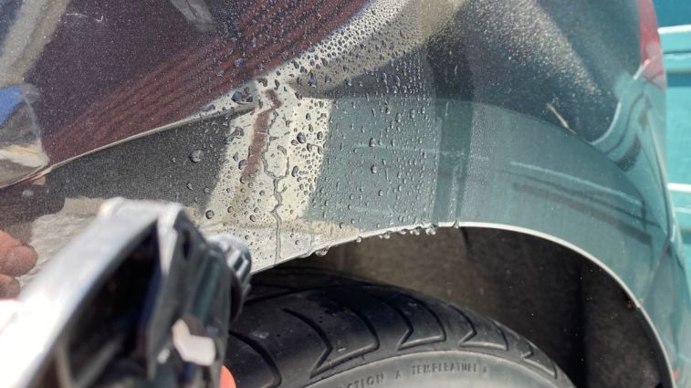 Rubbing Alcohol Sprayed on Car Paint