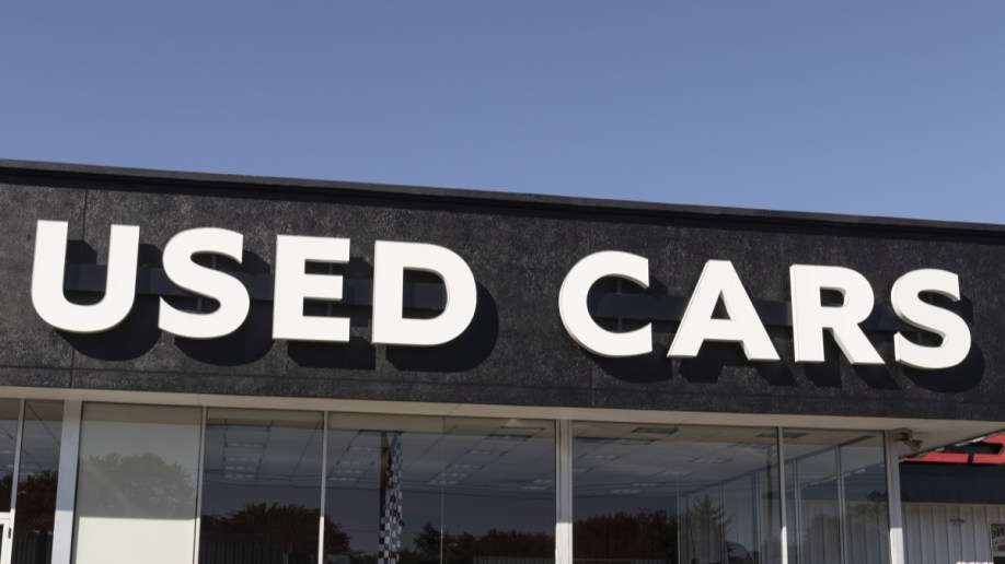 A used car sign on a dealership