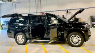 The GM Defense Heavy Duty SUV with all its armored doors open