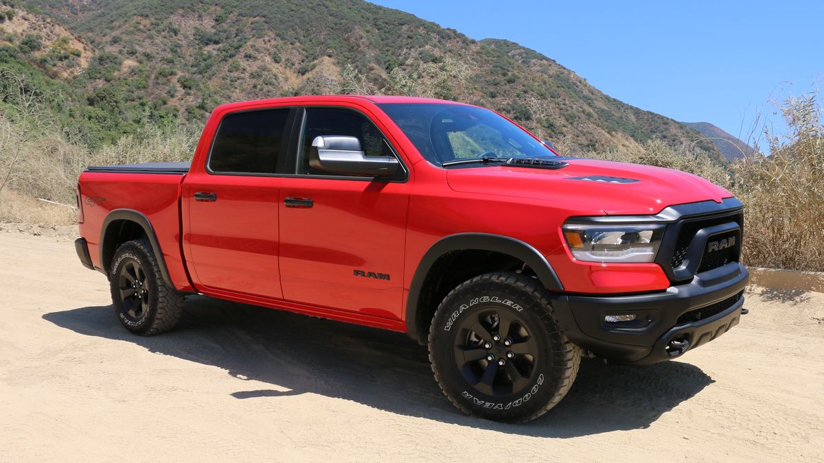 2023 Ram 1500 Rebel G/T in red with hills in the background.