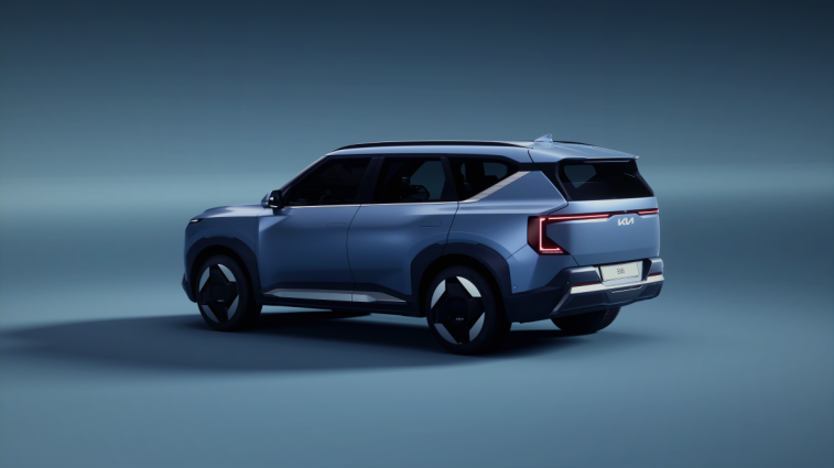 The 2025 Kia EV5 seen from a rear quarter angle