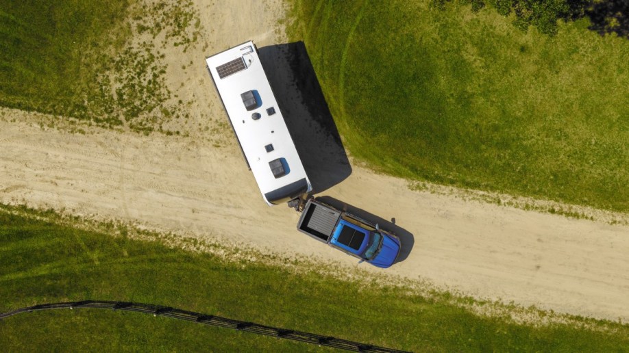 The 2024 Ford F-150 seen from overhead, backing up with a trailer attached