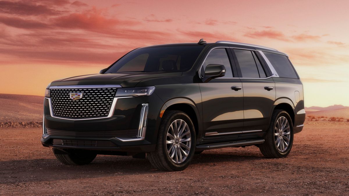 2023 Cadillac Escalade Luxury in black with clouds in the background.