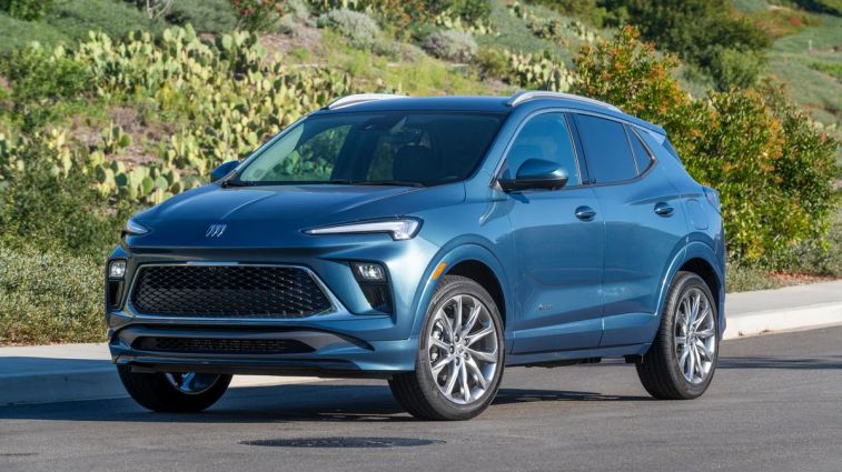 2024 Buick Encore GX Avenir with shrubs in the background.