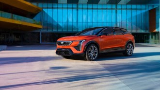 A teaser photo showing the Cadillac Optiq from a front quarter angle