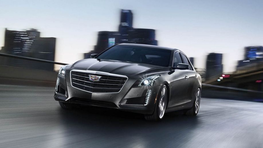 2015 Cadillac CTS sedan driving in the city.