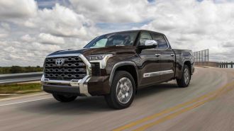 2024 Toyota Tundra 1794 Edition driving down a highway.