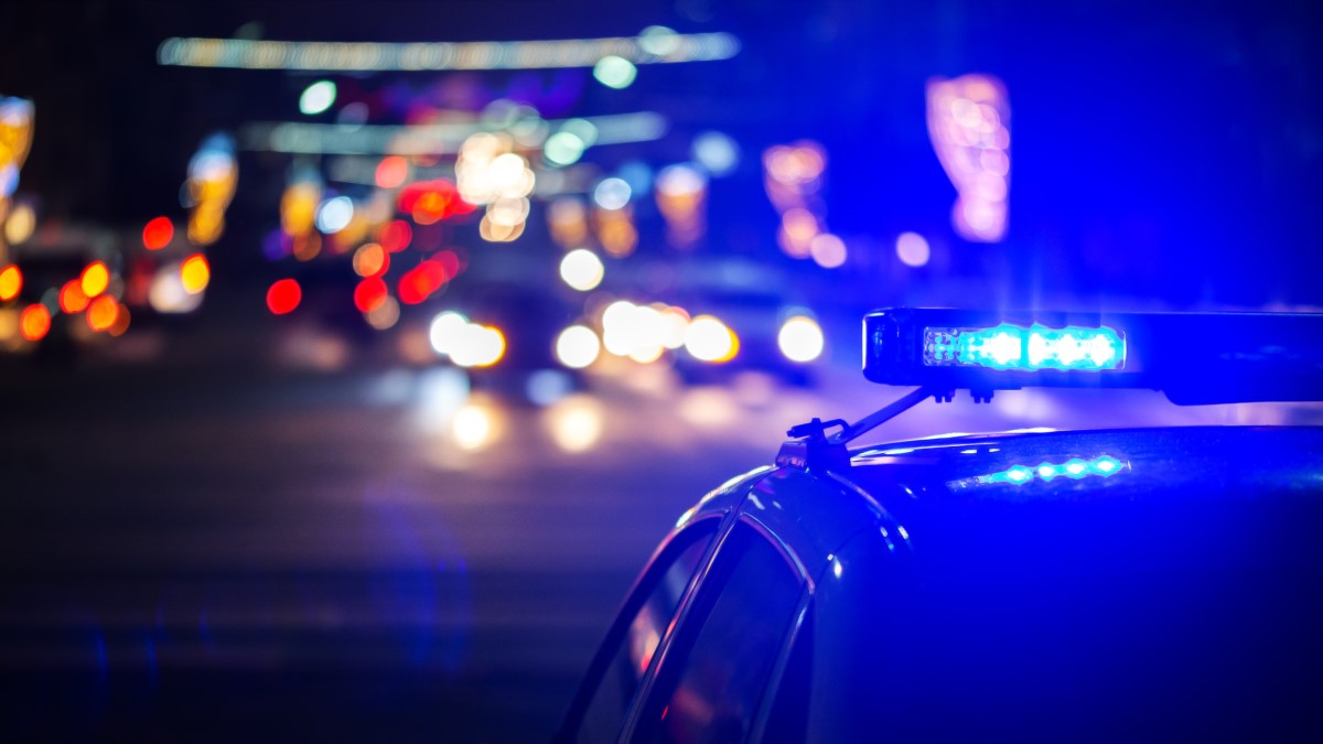 A police car seen at night