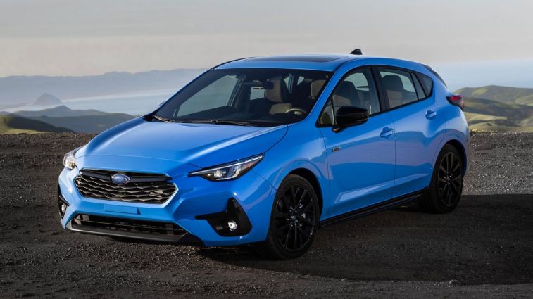 2024 Subaru Impreza RS with the ocean in the background.