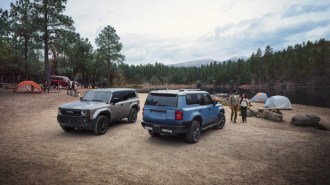 The Toyota Land Cruiser 1958 (facing) and Land Cruiser (facing away)
