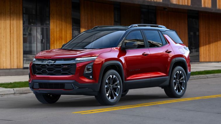 2025 Chevrolet Equinox RS in Radiant Red Tintcoat driving on a road.