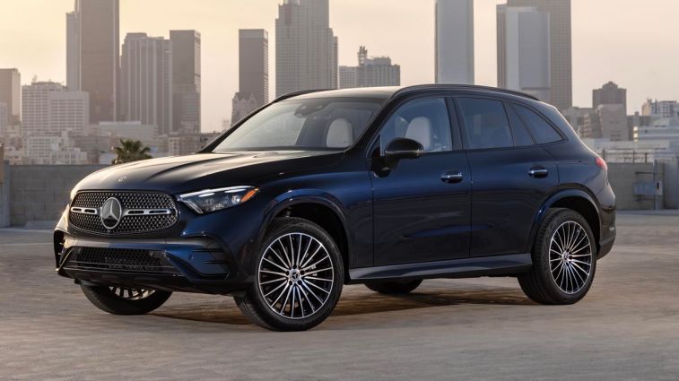 2024 Mercedes-Benz GLC 300 park on a roof top with city buildings in the background.