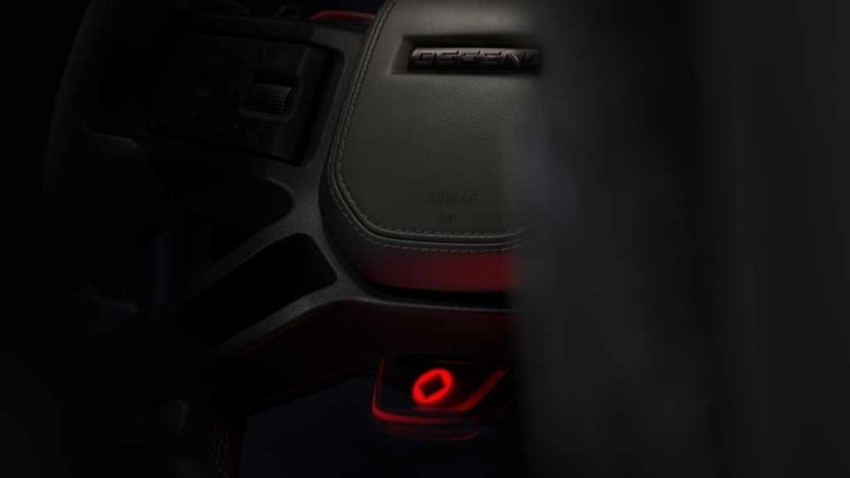 A teaser shot showing the steering wheel of the 2025 Defender Octa