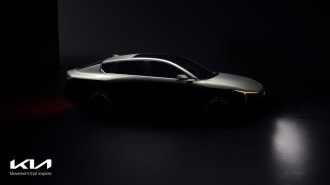 A teaser photo showing the 2025 Kia K4 from a front quarter angle