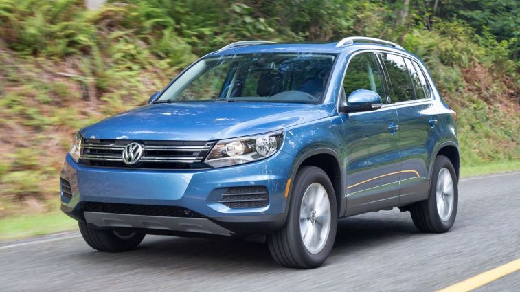 2017 Volkswagen Tiguan in blue driving on a road.