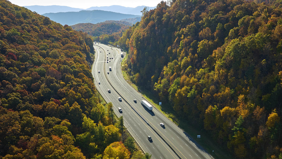 Cars driving on an interstate highway.