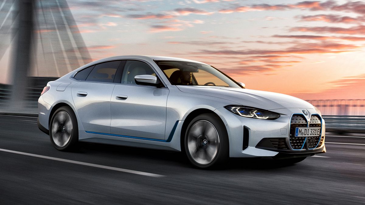 2024 BMW i4 driving over a bridge.